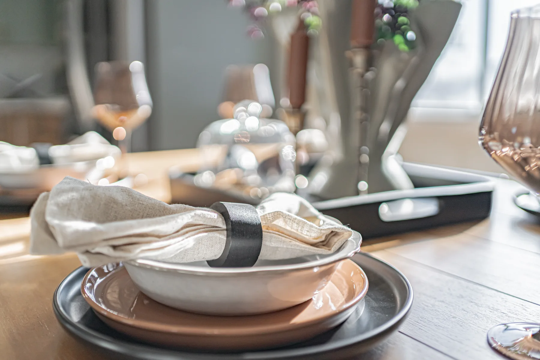 A styled dining tablescape in a new construction home staged by Style House