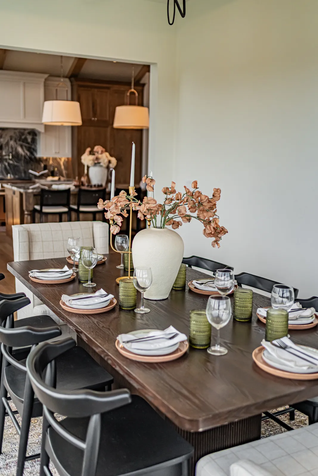 An editorial dining-and-kitchen view in a model home staged by Style House