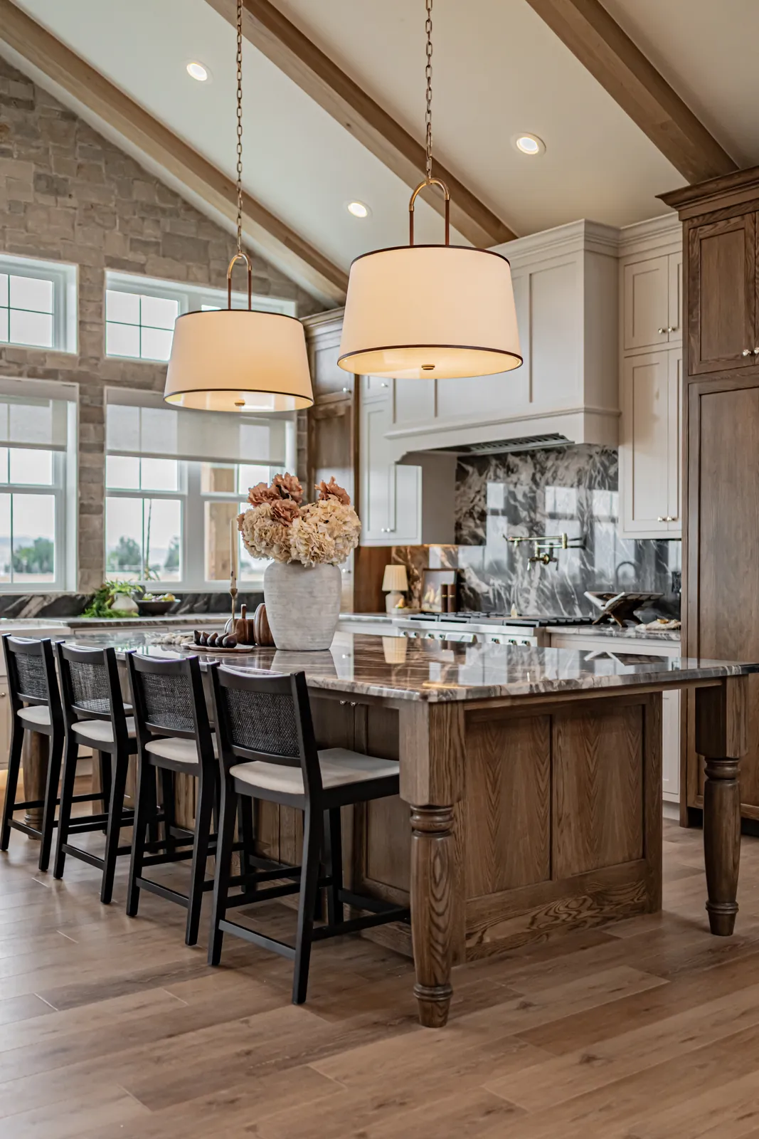 A vacant great room with vaulted ceilings staged by Style House