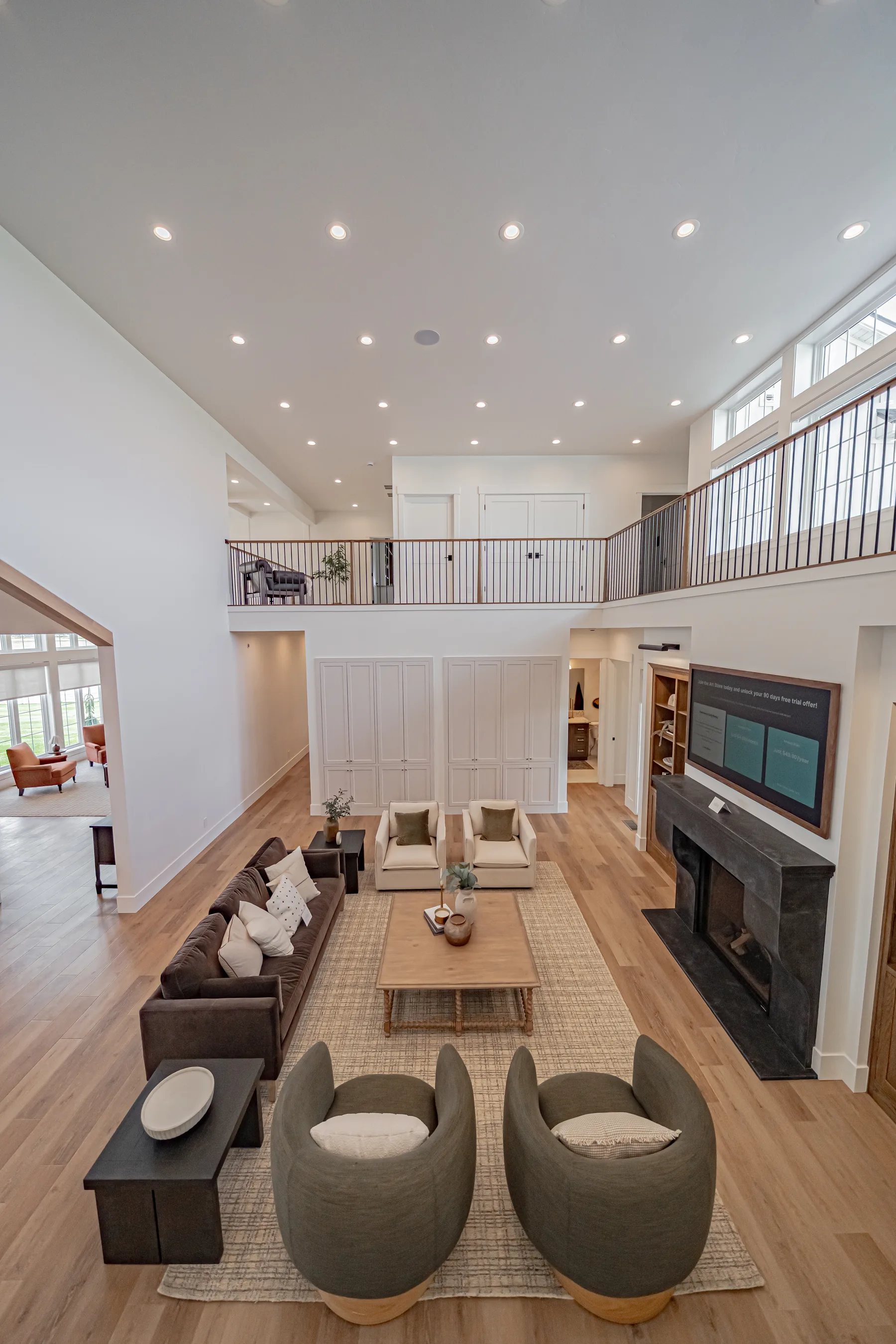 A two-story great room in a new construction home staged by Style House