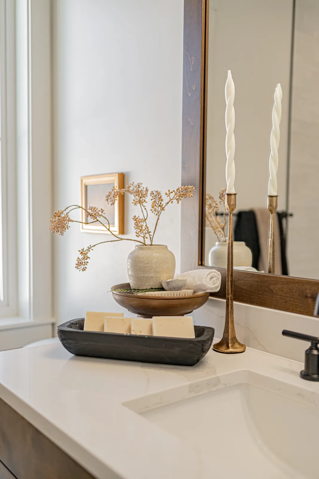 A staged bathroom vanity by Style House
